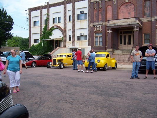 The buildings are older than the cars.